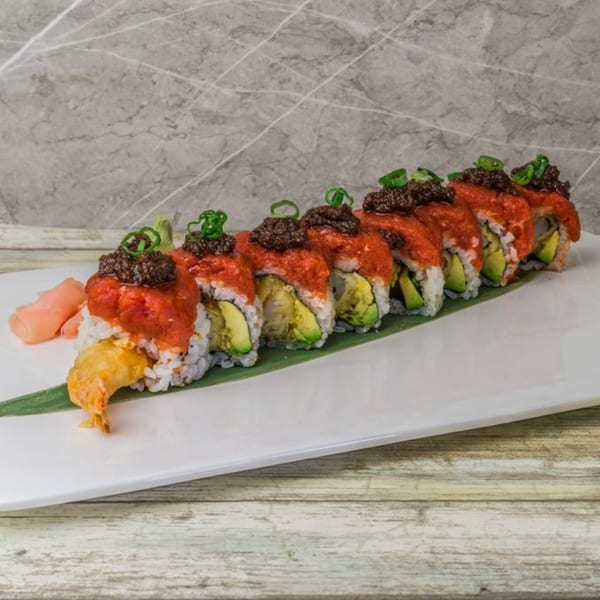 Nara Sushi Ramen's sushi roll with red topping, dark garnish, avocado, and tempura shrimp.